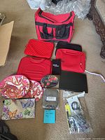 Full lot overview showing tote, sleeves, pouches, cables