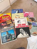 Top view of nine record jackets including Louis Armstrong, Andy Williams, Perry Como, etc.