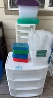 Overall lot showing dresser, flat bins, small colored boxes, narrow drawer tower behind
