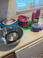 group view showing stainless bowls, plastic bowls, cups, container
