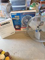 Patton floor fan, Lasko Wind Machine box, Lorell oscillating fan box