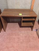Front view of desk showing kneehole and shelves
