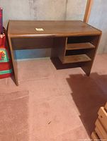 Front view showing work surface and shelves
