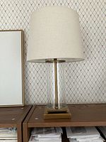 Full view of lamp with shade on wood surface