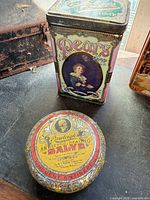 Pears Soap tin and Rawleigh Salve tin on table