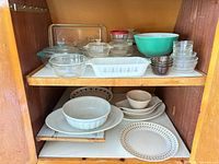 Overall view of all glassware and ceramic items on shelves