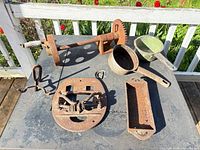 Entire lot including gear crank, cookware, hardware on table