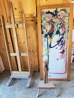 Easel, tapestry frame and string counter grouped