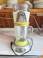 Full view of Margaritaville frozen drink maker showing jar, ice hopper and base