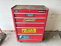Front view of red Mastercraft rolling tool chest with decals