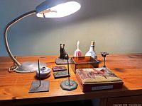 Full lot showing lamp, tin, figurines, ceramics, spikes