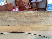 Back edge of framed watercolour showing wood frame and hanging wire