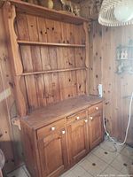 Full view of pine cupboard showing upper shelves and lower cabinet