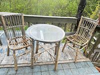 Wide view of rattan table and two chairs on deck
