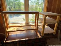 Both wooden tables showing size and shelf configuration