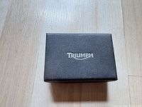 Closed black Triumph box