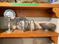 Shelf view showing all five pewter pieces side by side