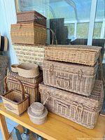 Full group of stacked wicker baskets on table