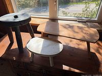 Three wooden pieces on surface