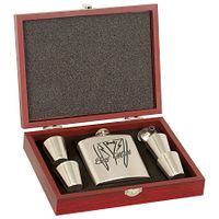 Open rosewood box showing flask, four shot glasses, funnel in foam insert