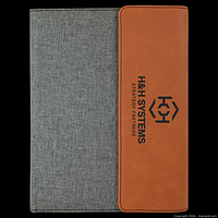 Front view showing grey canvas body and rawhide faux-leather strip with sample engraving