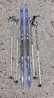 Top view of Atomic skis with two pole sets