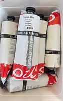 Group of sealed Daler-Rowney Graduate Titanium White tubes in bin