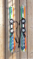 Top view of both K2 Fatty snowblades showing graphics and bindings