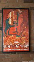 Full view of framed poster against brick wall