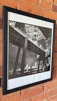 Full view of framed photograph on wall