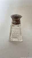 Perfume bottle assembled showing overall form