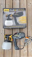 Sprayer next to original box showing model