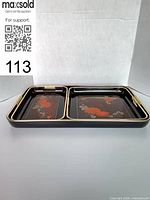 Set of three trays nested, showing interior floral design