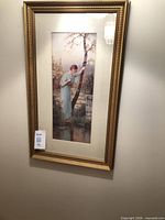Full view of framed art print on wall