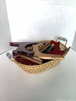 Basket containing multiple folded display easels in various colors