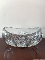 front view of cut crystal bowl showing pinwheel cuts and scalloped rim