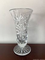 Front view of clear cut crystal trumpet vase with pinwheel pattern