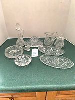 Group shot of all nine pressed glass pieces
