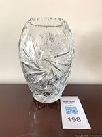 Front view of clear lead crystal vase showing pinwheel cut pattern