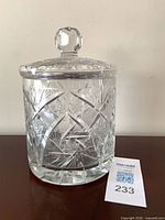 Front view of clear cut crystal jar and lid