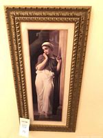 Full view of framed print showing subject, frame style and proportions