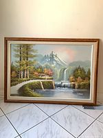 Full view of framed landscape painting