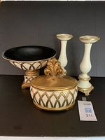 Group view of compote, lidded container, pair of candlesticks
