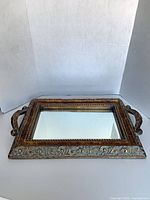 Top view of entire tray showing mirror and ornate frame