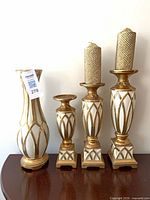 Front view of vase, candlestick holders and candles