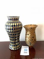 Vase and hurricane standing to show overall appearance and pattern
