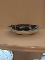 Side profile of shallow flared glass bowl