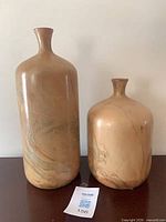 Large and medium marbled ceramic vases side by side