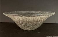 Side view of clear crackle glass bowl