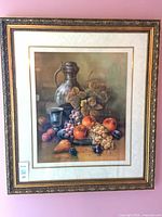Full view of framed still life print on wall